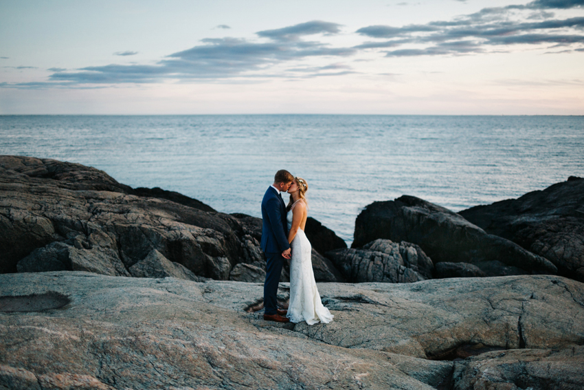Romantic and creative wedding photography at sunset along the rocky cilff walk water in Newport, Rhode Island by destination wedding photographer Renee Nicole Photography