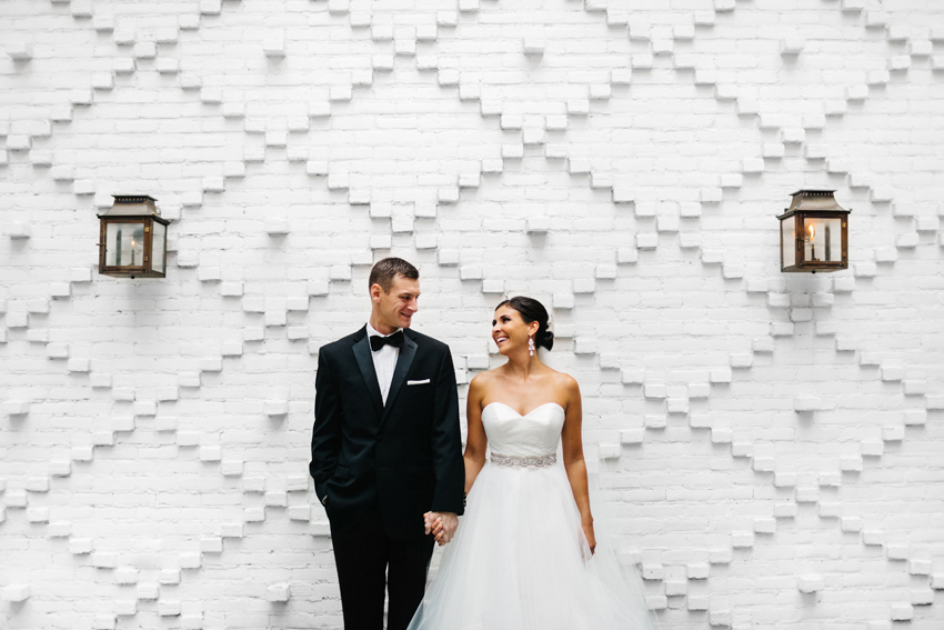 Industrial loft wedding venue with a exposed white brick wall in downtown Tampa