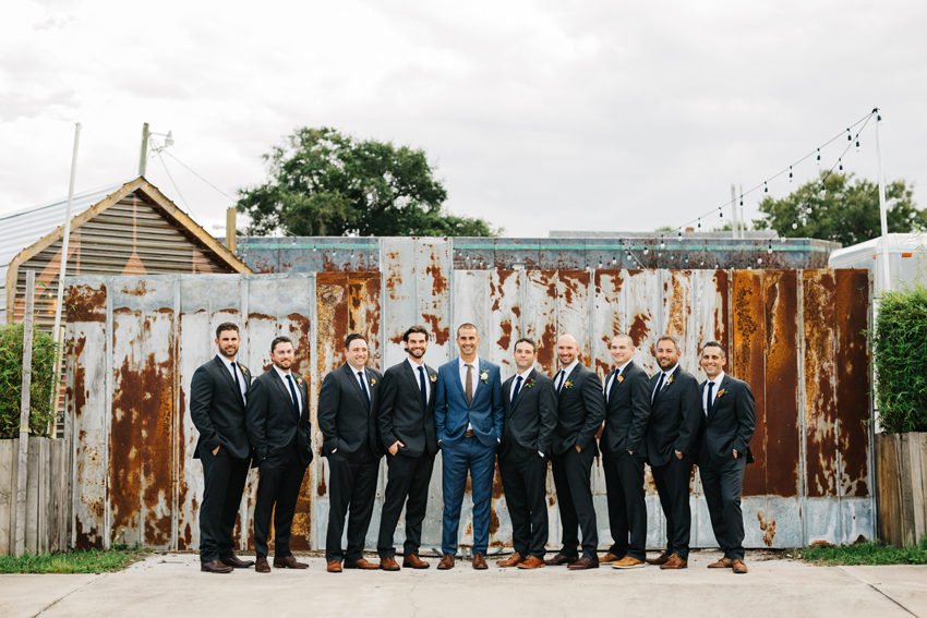 groomsmen standing with his group of groomsmen before the ceremony