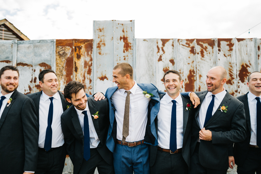 fun candid photo of groomsmen laughing