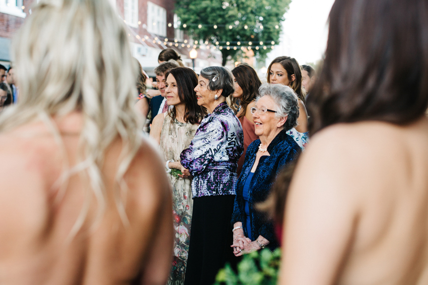 mother of the bride smiling during the ceremony