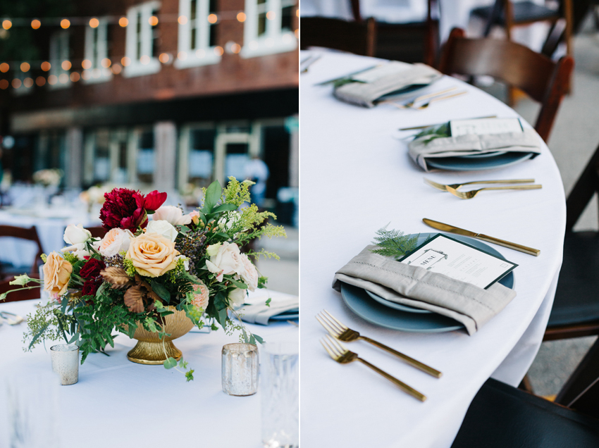 Wedding reception details with lush florals, ferns, and gold flatware