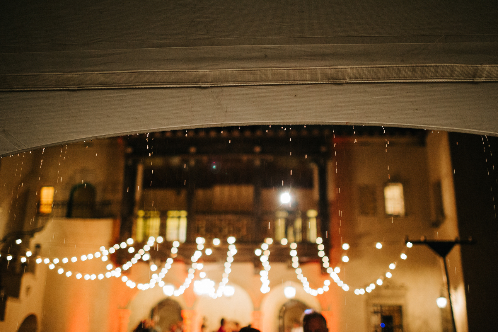 Rainy wedding under the twinkle lights