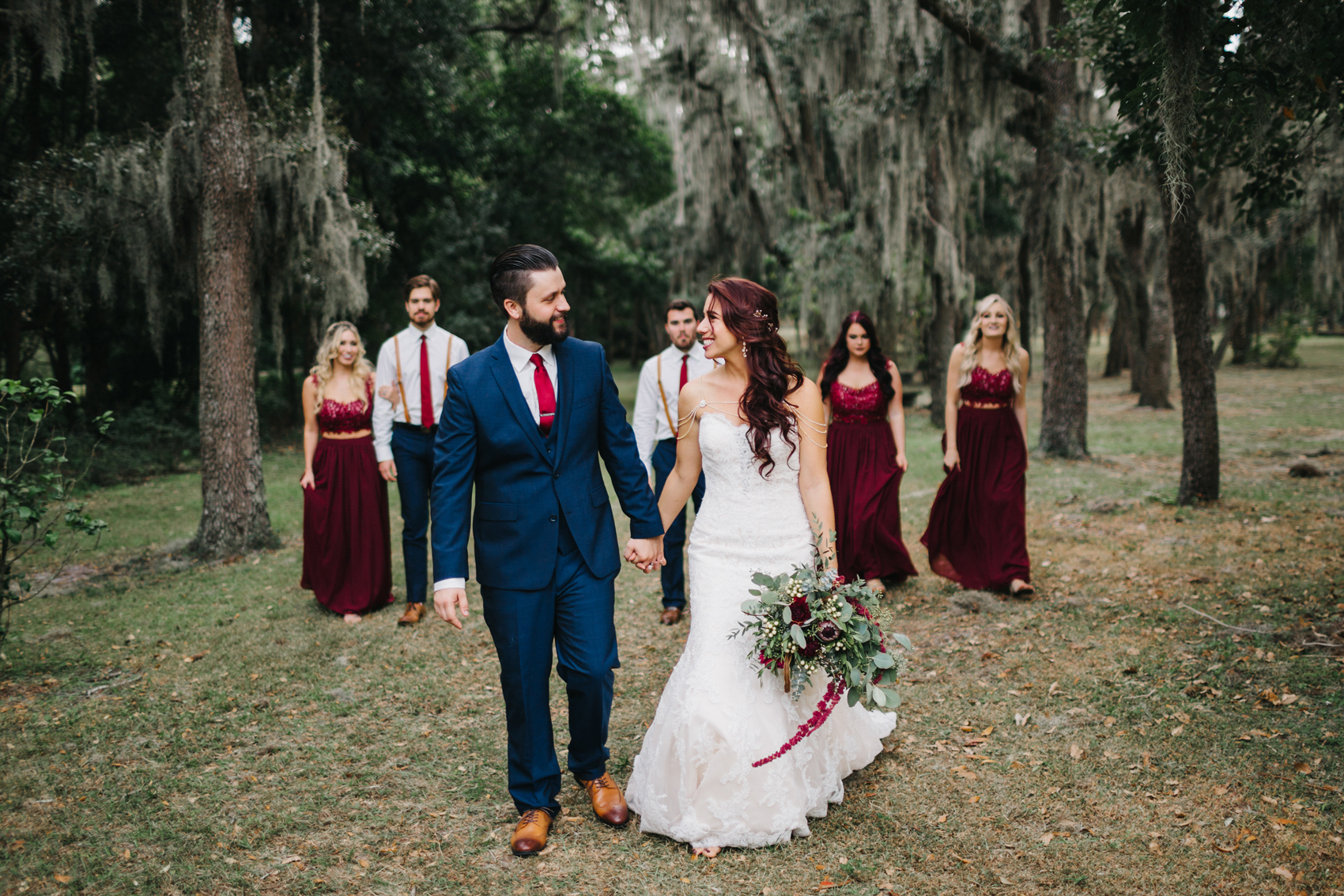 Burgundy and navy wedding party styling in the woods