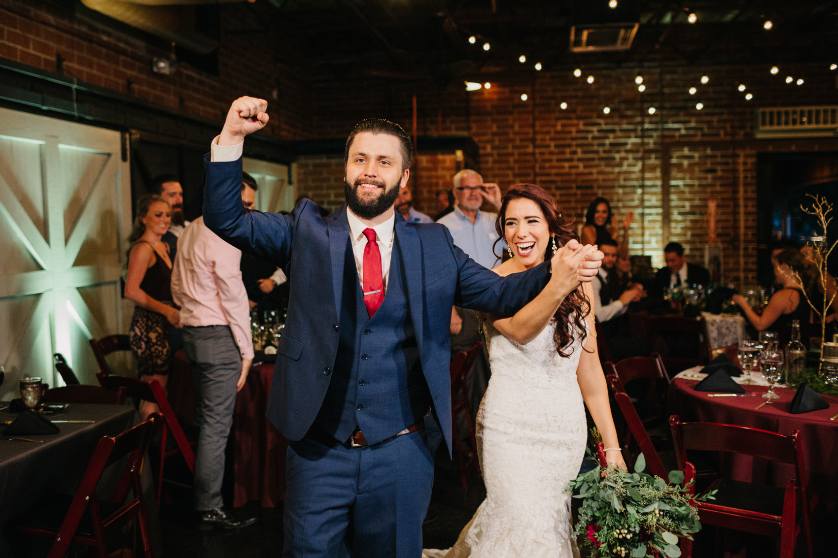 bride & groom cheering during the Orlando reception