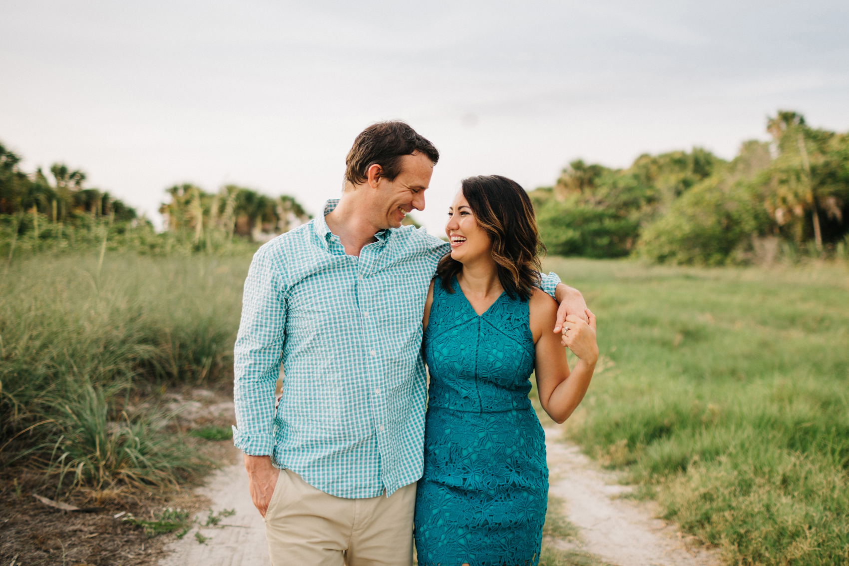 Adorable couple laughing during engagement session in St. Pete Florida