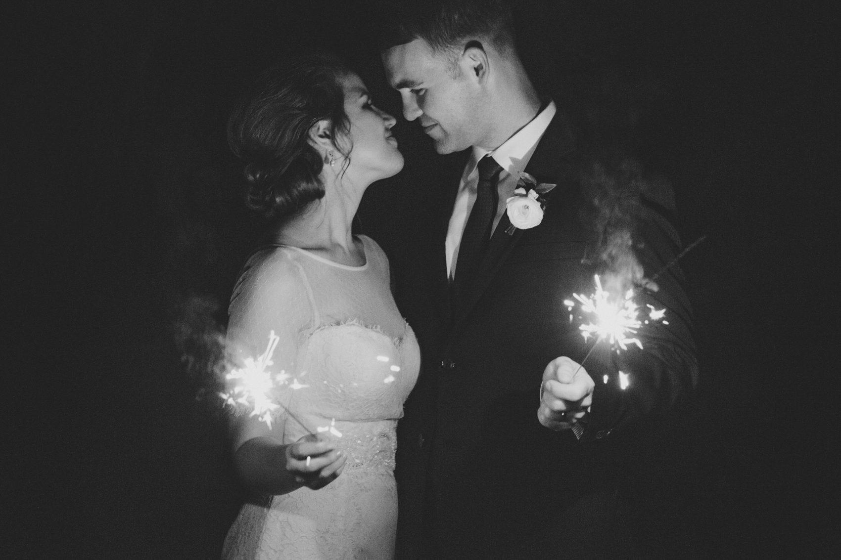 Orlando wedding photography at an outdoor garden with romantic black and white sparkler photo at the end of the reception