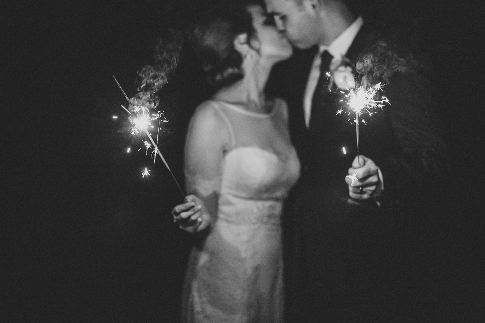 Romantic black and white sparkler photos of the bride and groom at outdoor garden Orlando wedding by Renee Nicole Photography