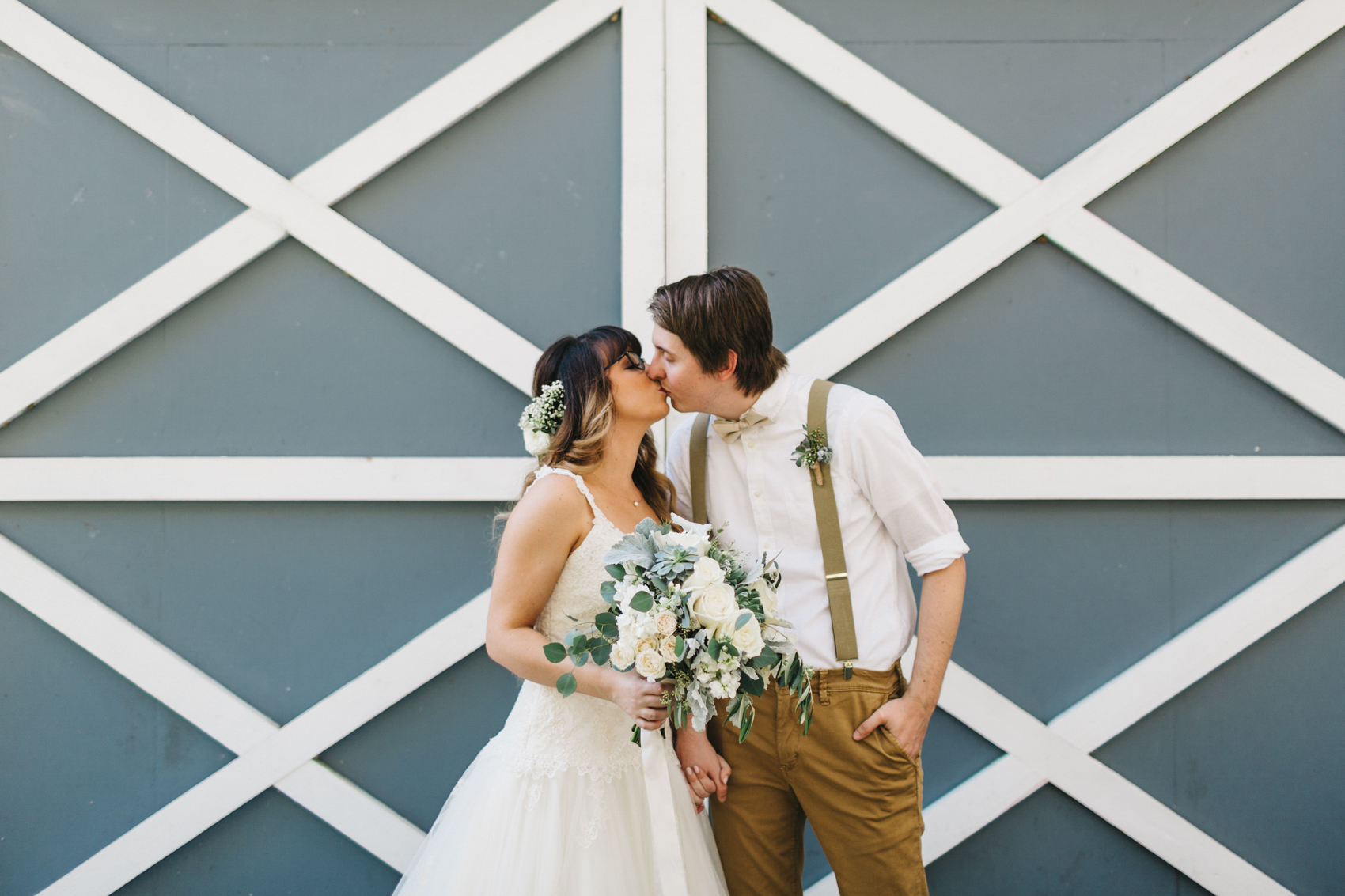 rustic wedding photos in front of the barn at the lange farm