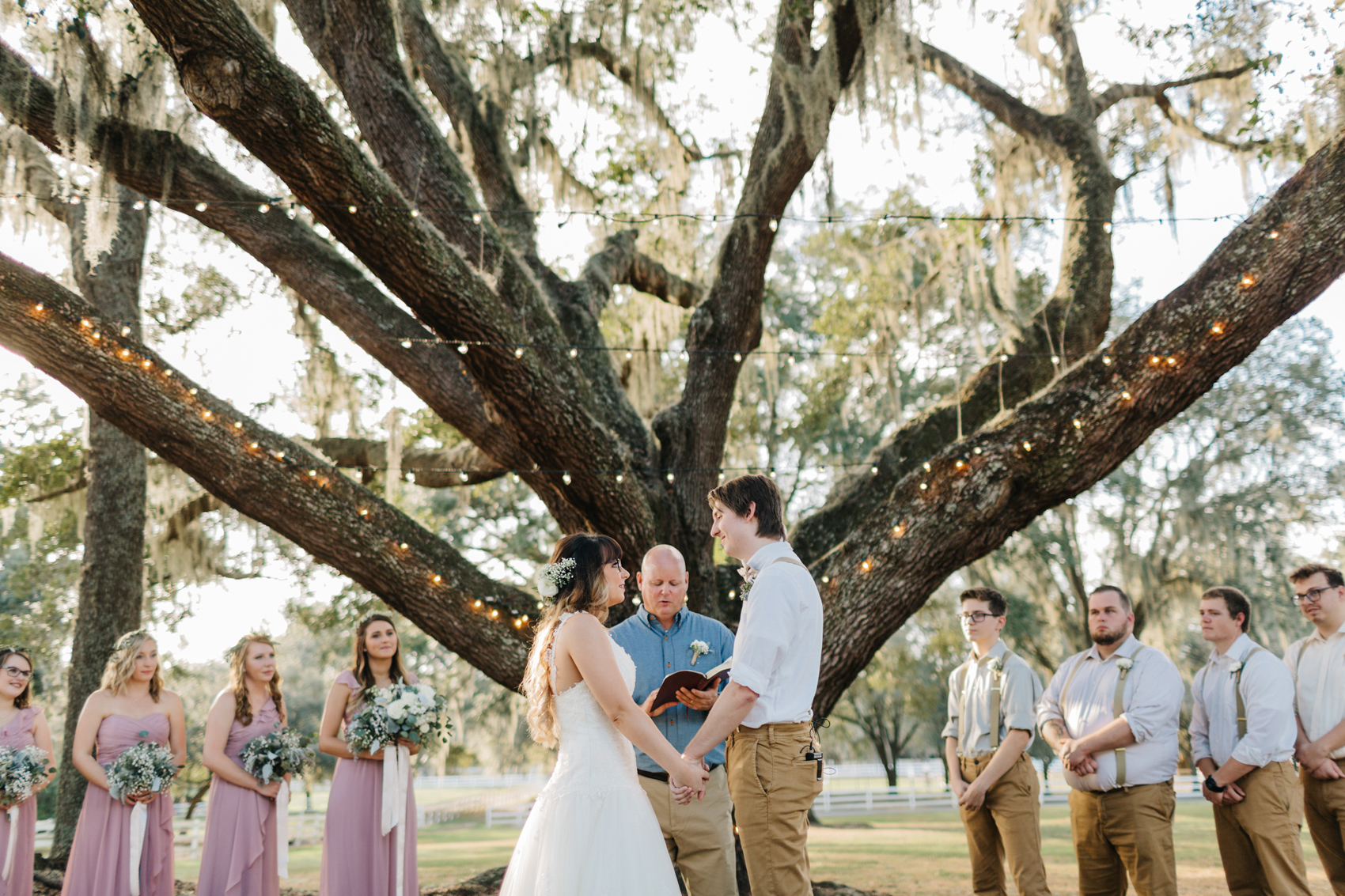 romantic ceremony under the oak trees at the lange farm