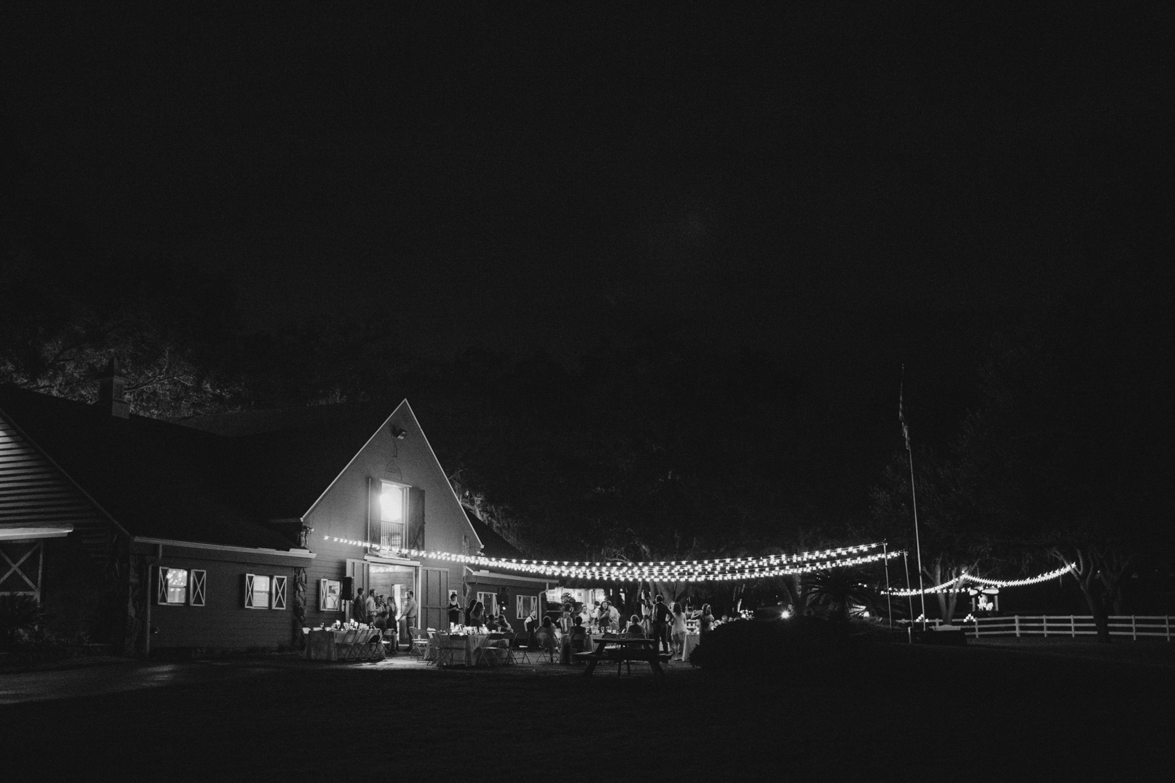 rustic florida barn wedding venue at nighttime with stringlights