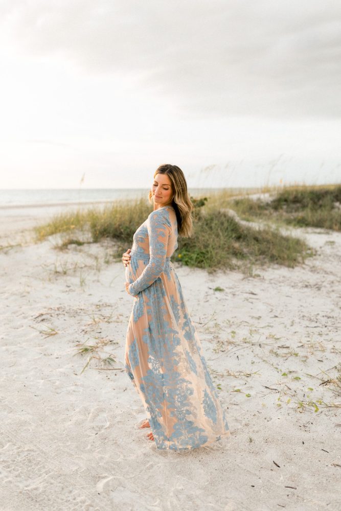 Maternity session on fort de soto beach at sunset in a blue Anthropologie dress