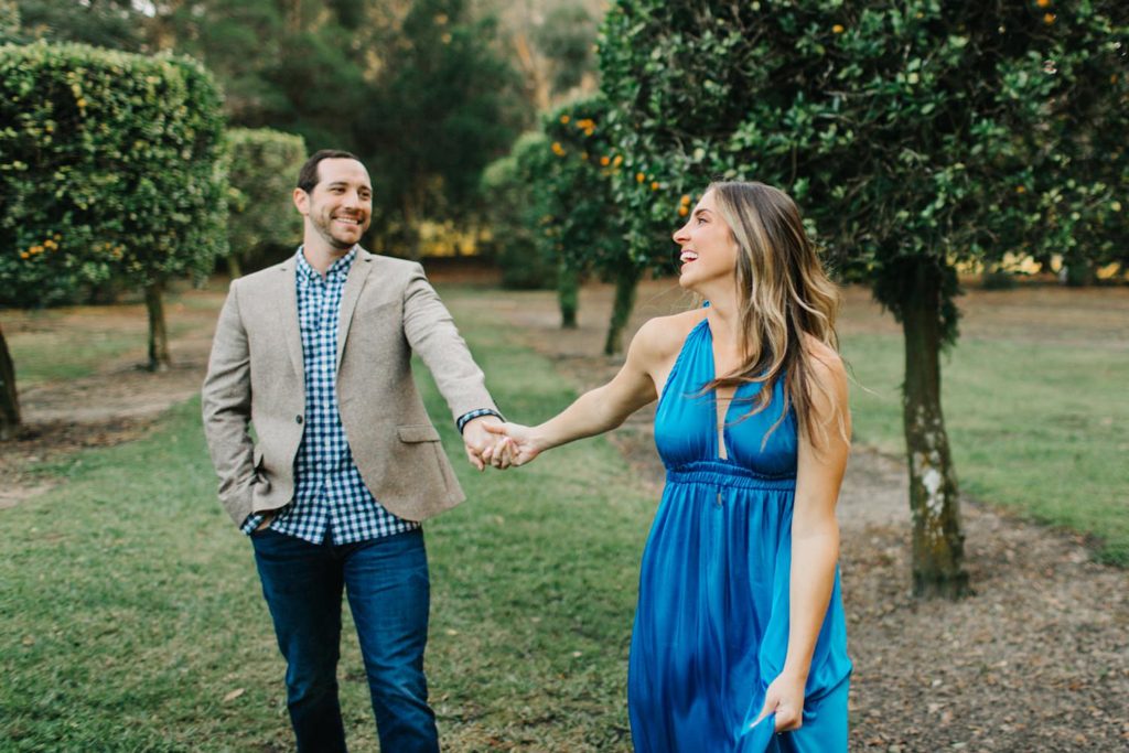 candid engagement photos by tampa wedding photographer at bok tower gardens