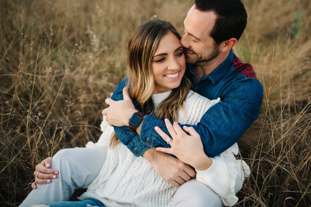 romantic engagement photos in a field by orlando wedding photographer
