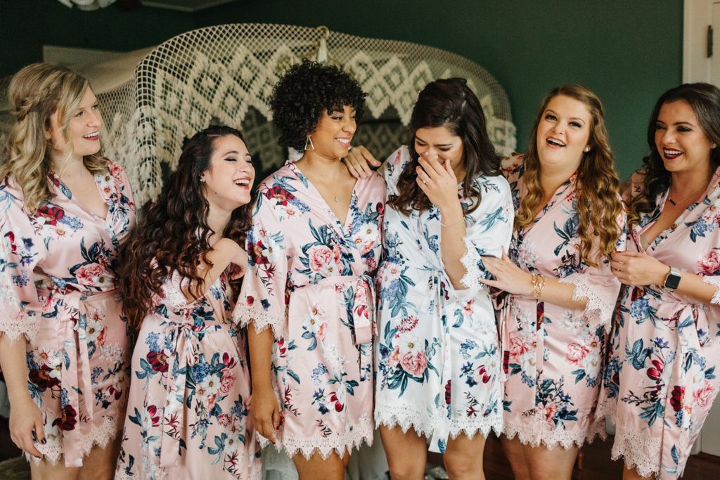 Sweet fun bridesmaids wearing le rose robes while getting ready