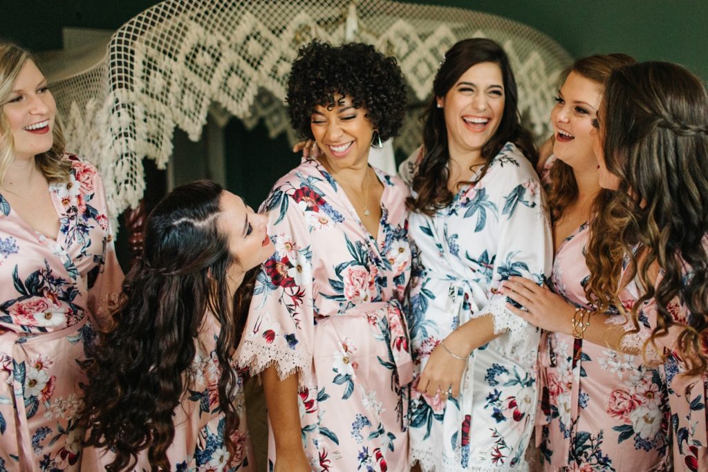 bridesmaids wearing blush pink floral robes from le rose robes