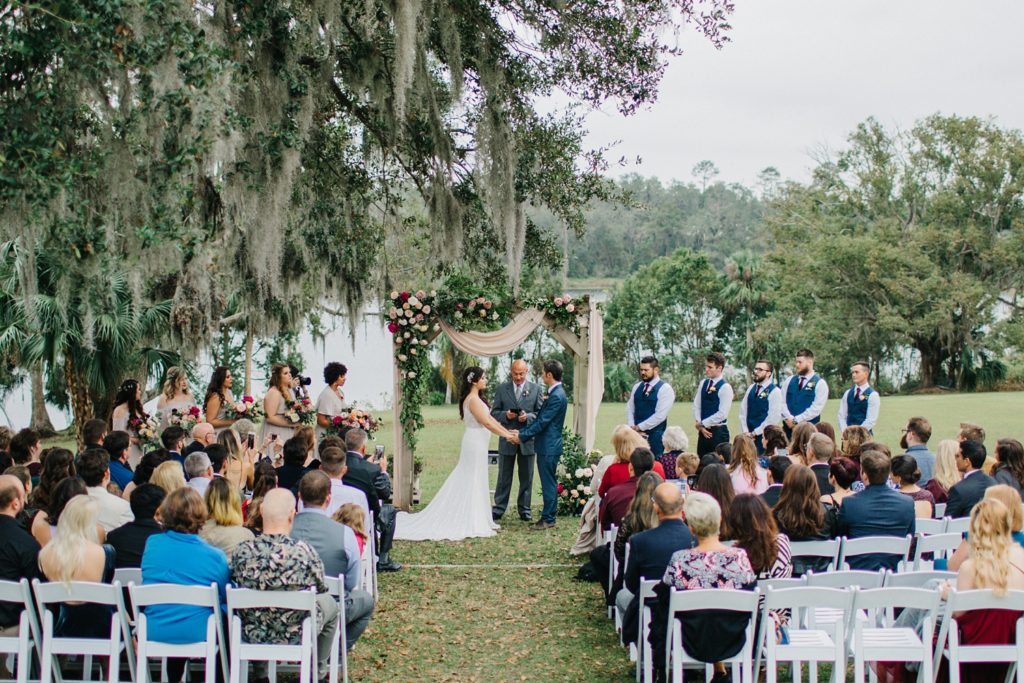 outdoor wedding ceremony under the oak trees at Orlando wedding venue Sydonie Mansion