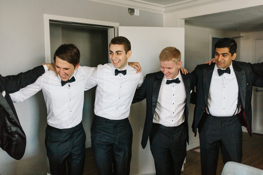 groom and groomsmen hanging out before the wedding