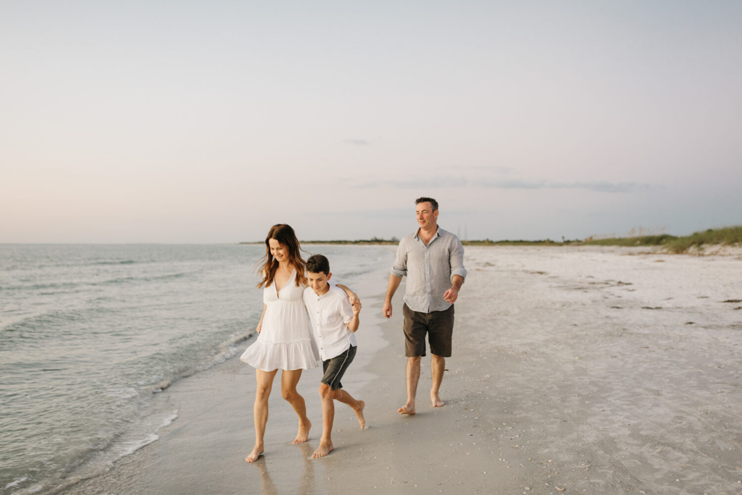 candid family photos on the beach at fort desoto park