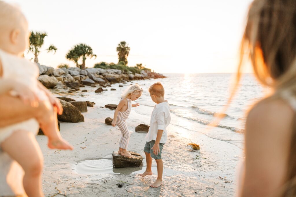 Children playing on the beach for their Tampa family session