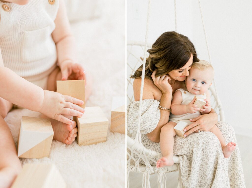 baby snuggling mom while playing with blocks